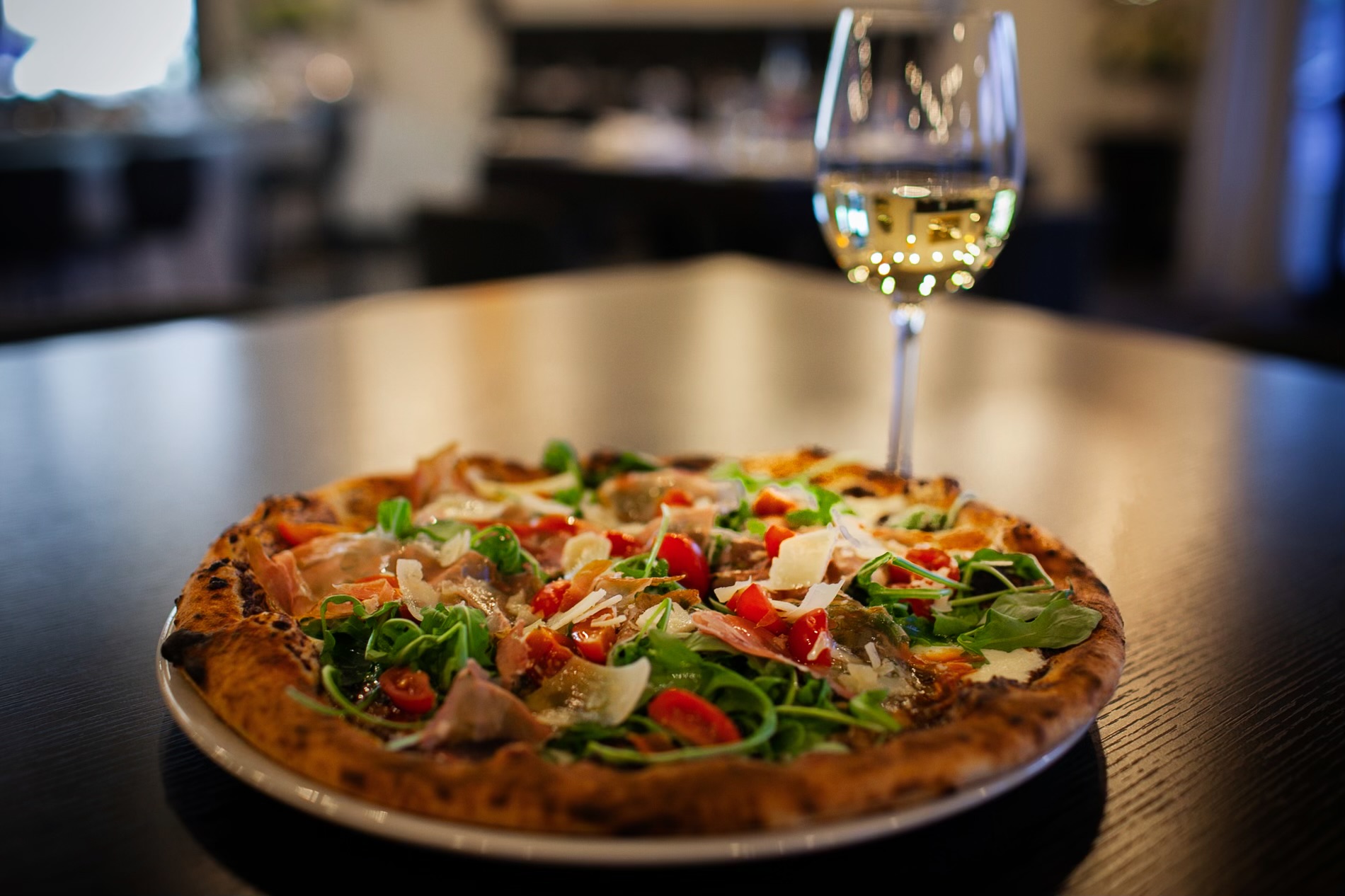 Wood-fired pizza and white wine